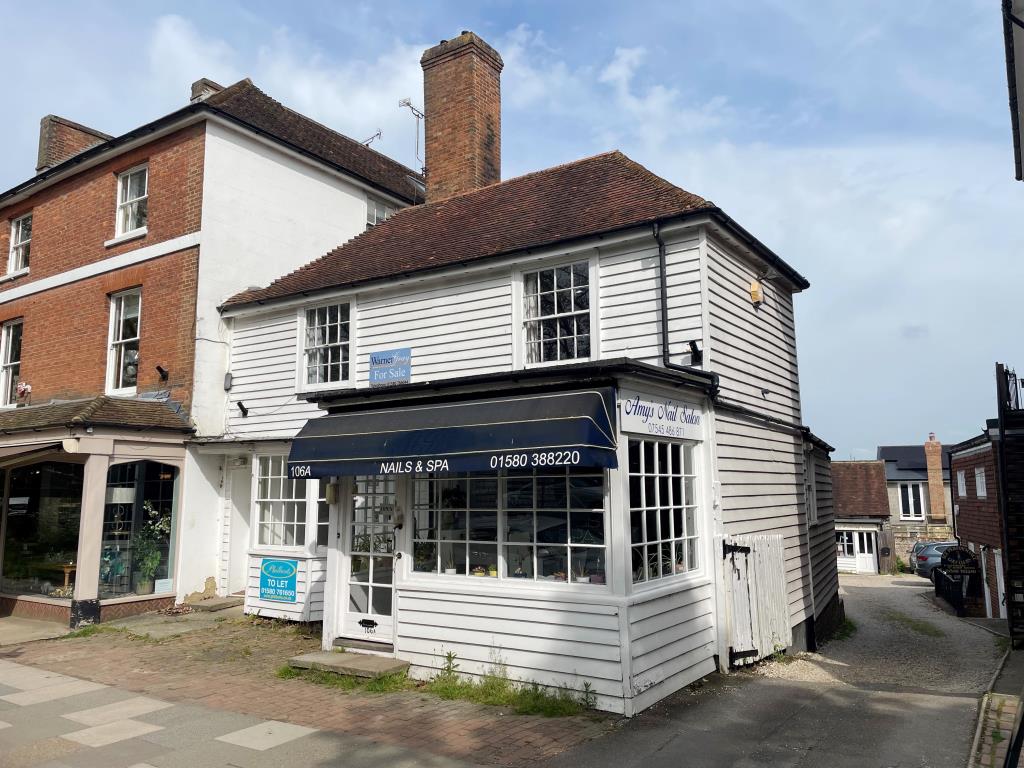 Lot: 24 - TWO SHOPS AND APARTMENT WITH PLANNING FOR OFFICE BUILDING IN PICTURESQUE TOWN - Weather boarded corner property